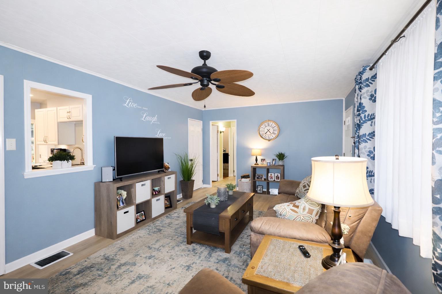 418 Perkins Lane Delanco, NJ 08075 - Photo 8 of 17 Charming living space with serene blue tones.