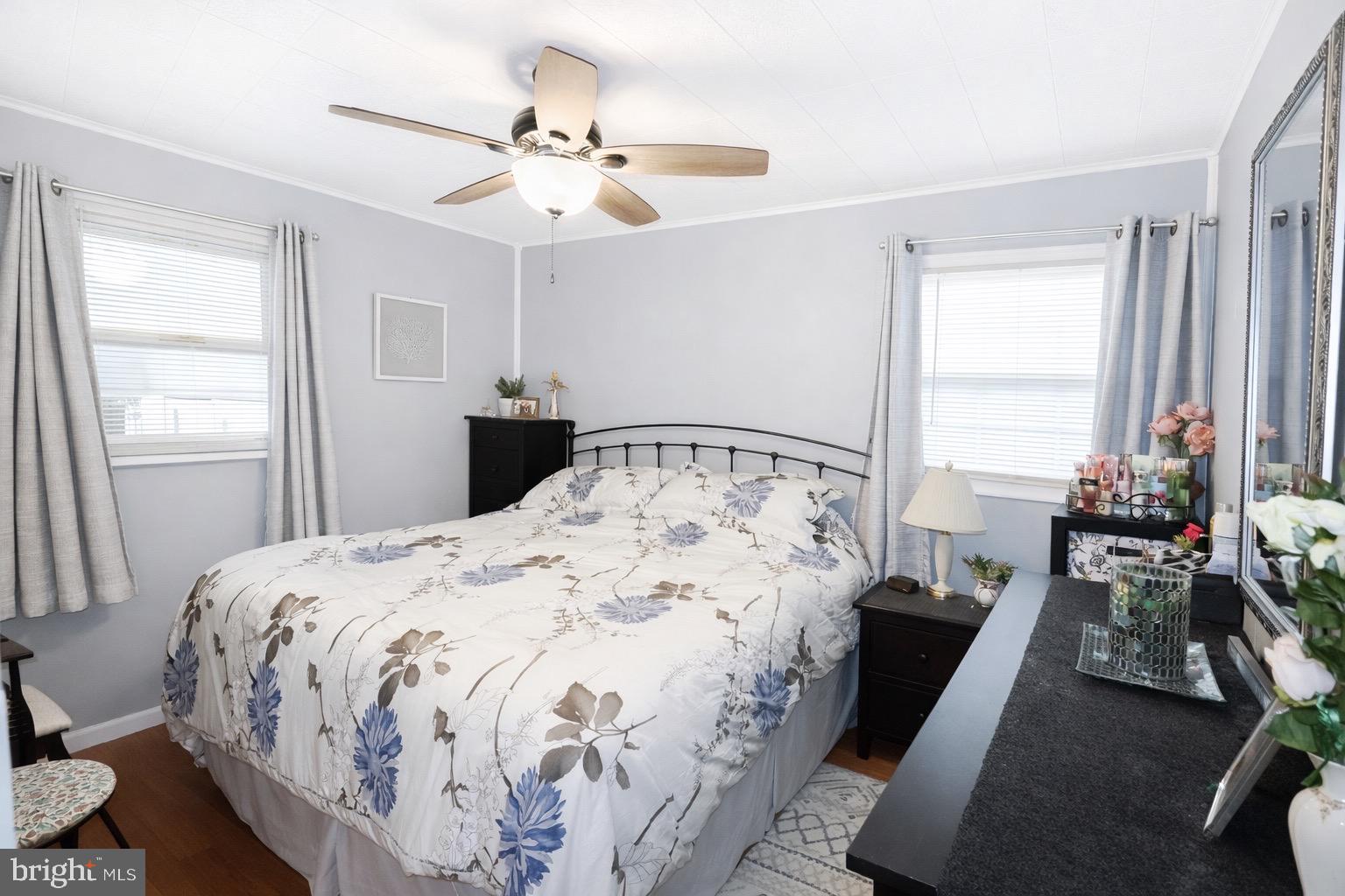 418 Perkins Lane Delanco, NJ 08075 - Photo 9 of 17 Cozy bedroom with floral accents and light.