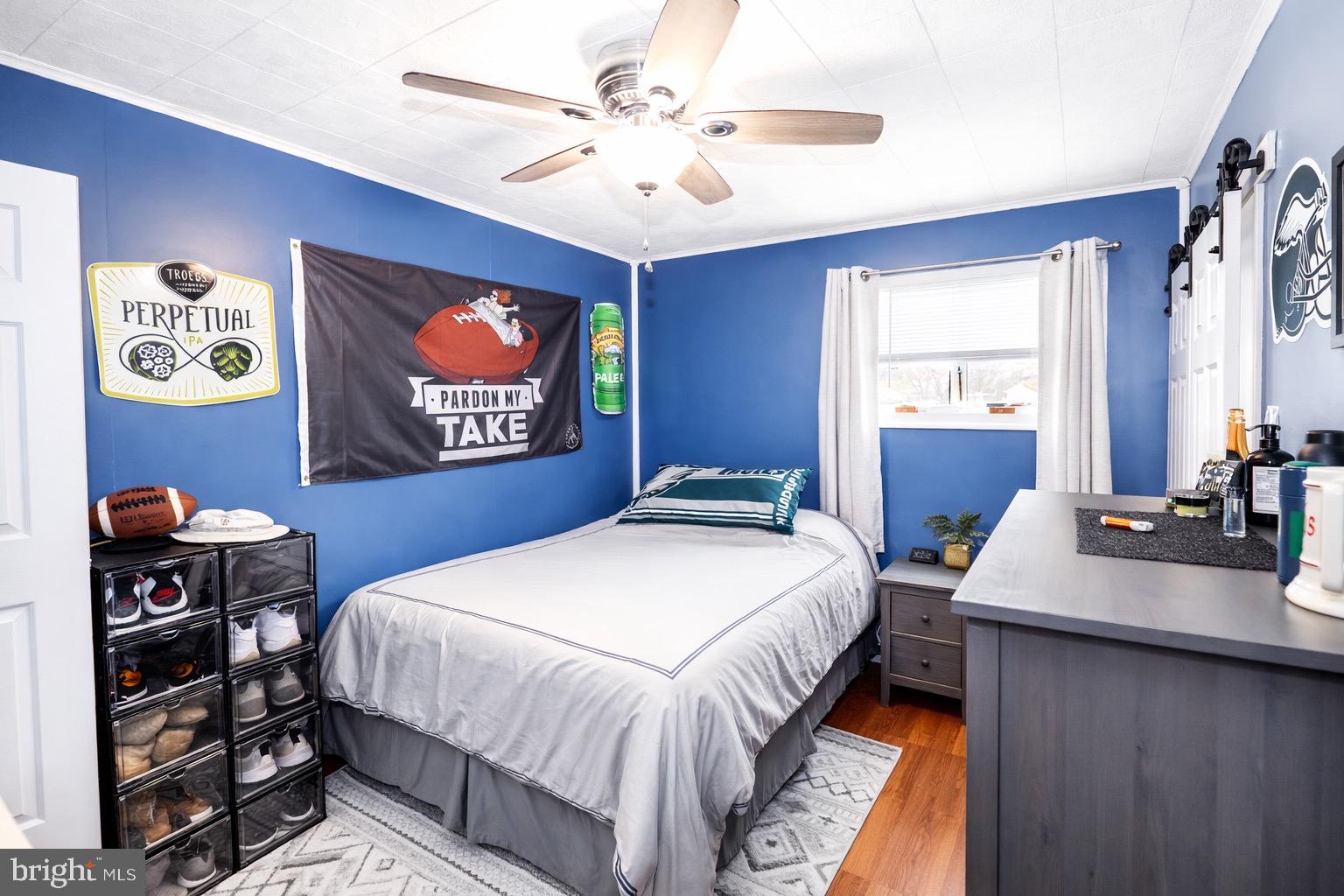 418 Perkins Lane Delanco, NJ 08075 - Photo 10 of 17 Cozy blue-hued bedroom with sporty decor.
