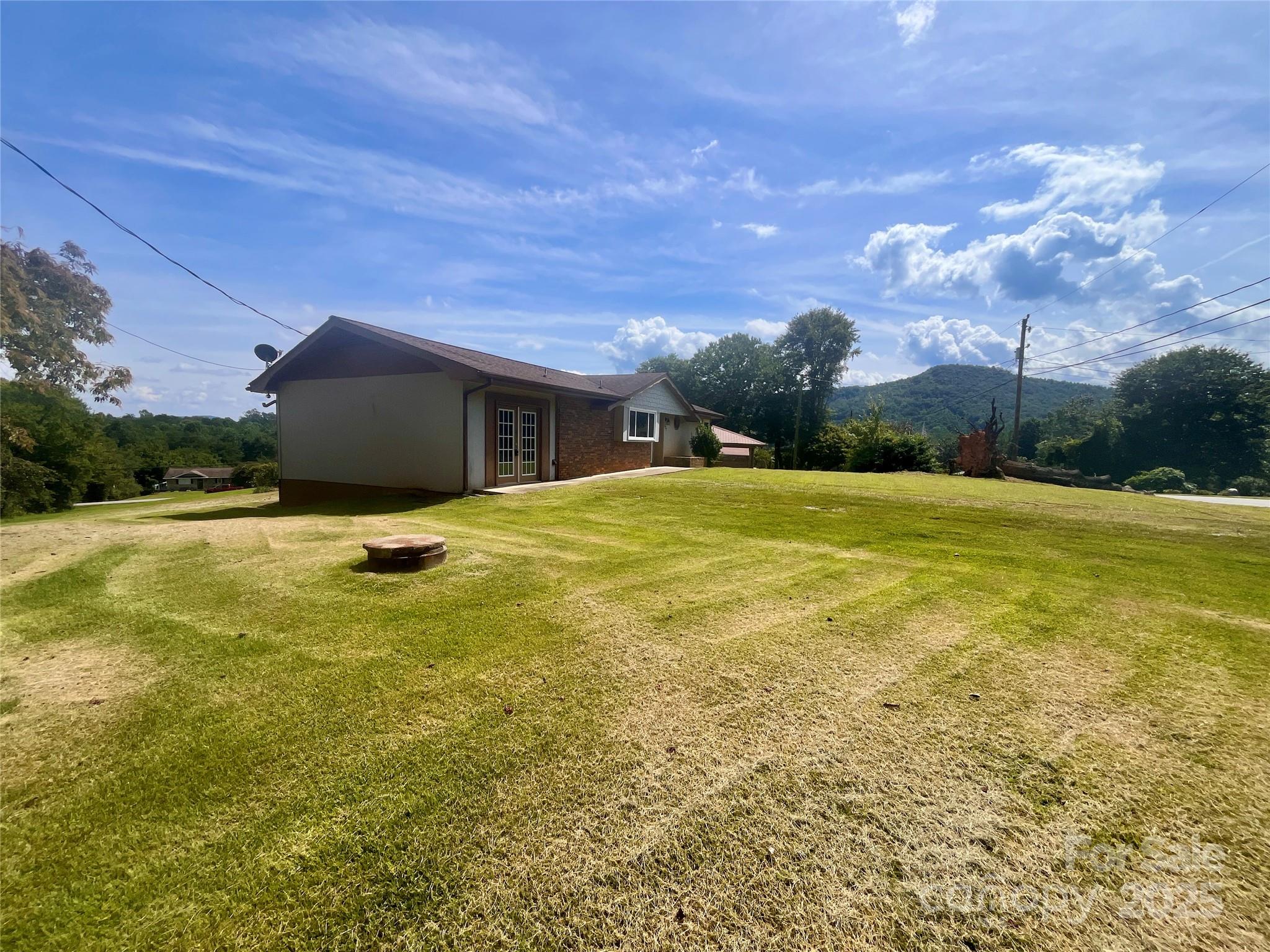 657 Arrowhead Trail Marion, NC 28752 - Photo 16 of 22 a view of a swimming pool with an outdoor space and seating area
