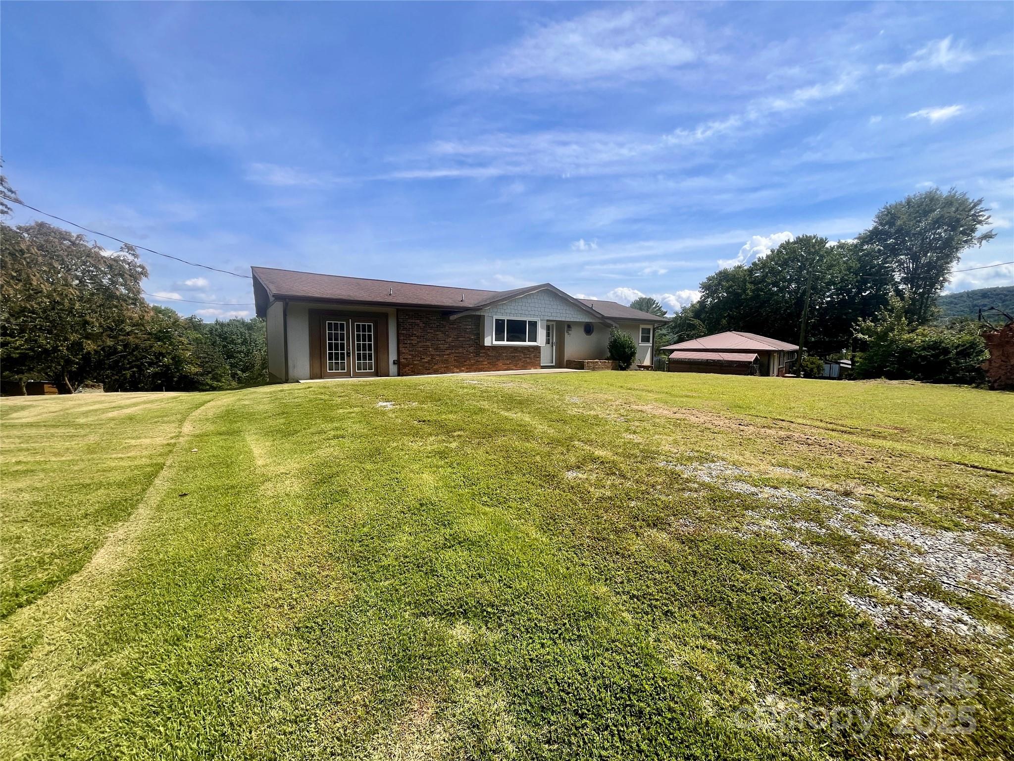 657 Arrowhead Trail Marion, NC 28752 - Photo 17 of 22 a view of a house with a yard
