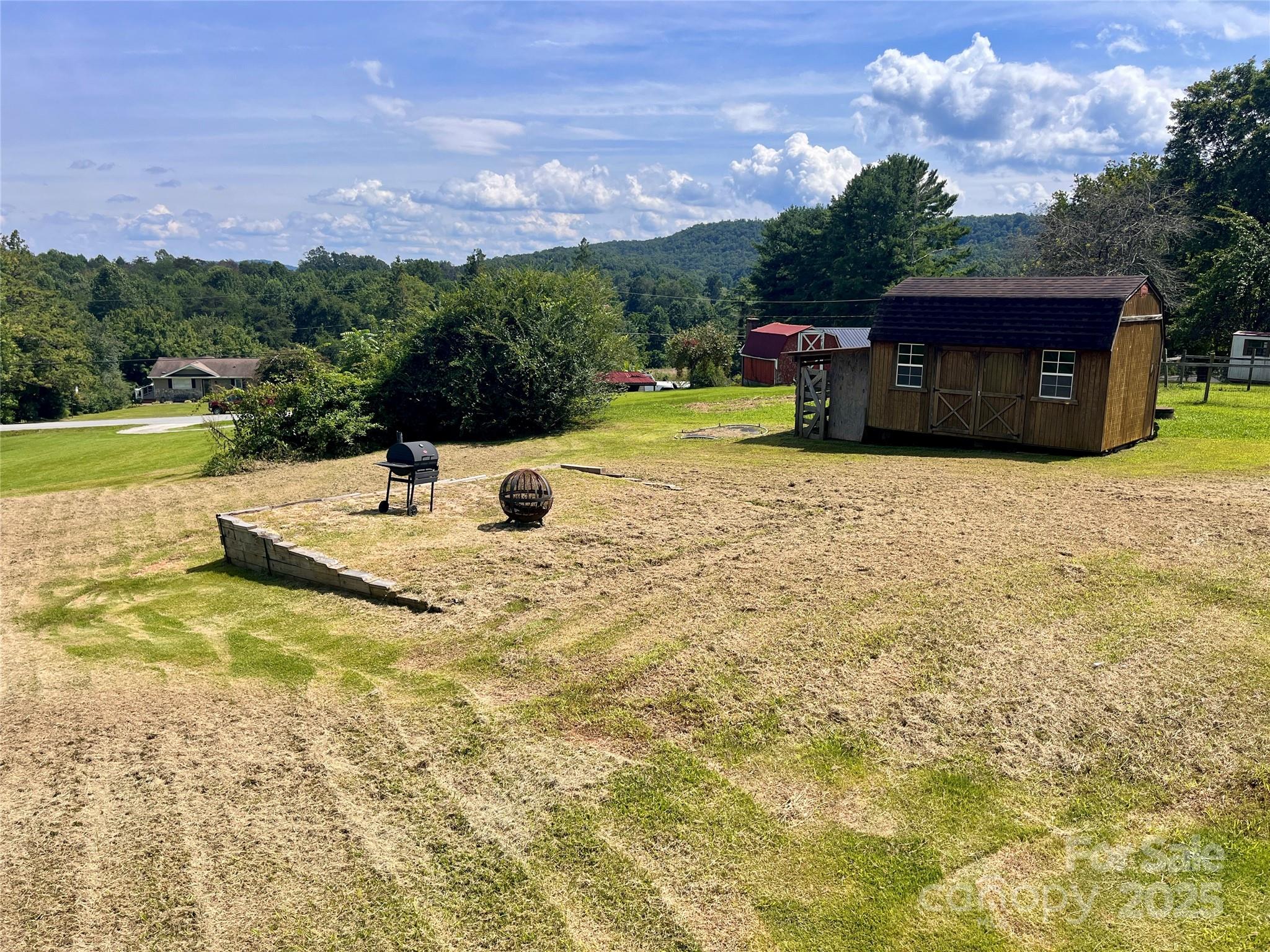 657 Arrowhead Trail Marion, NC 28752 - Photo 20 of 22 a view of a swimming pool with a yard