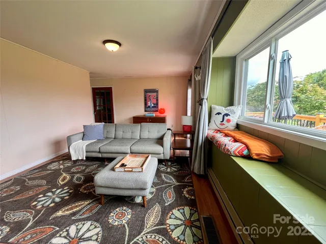 a outdoor living space with furniture and a floor to ceiling window