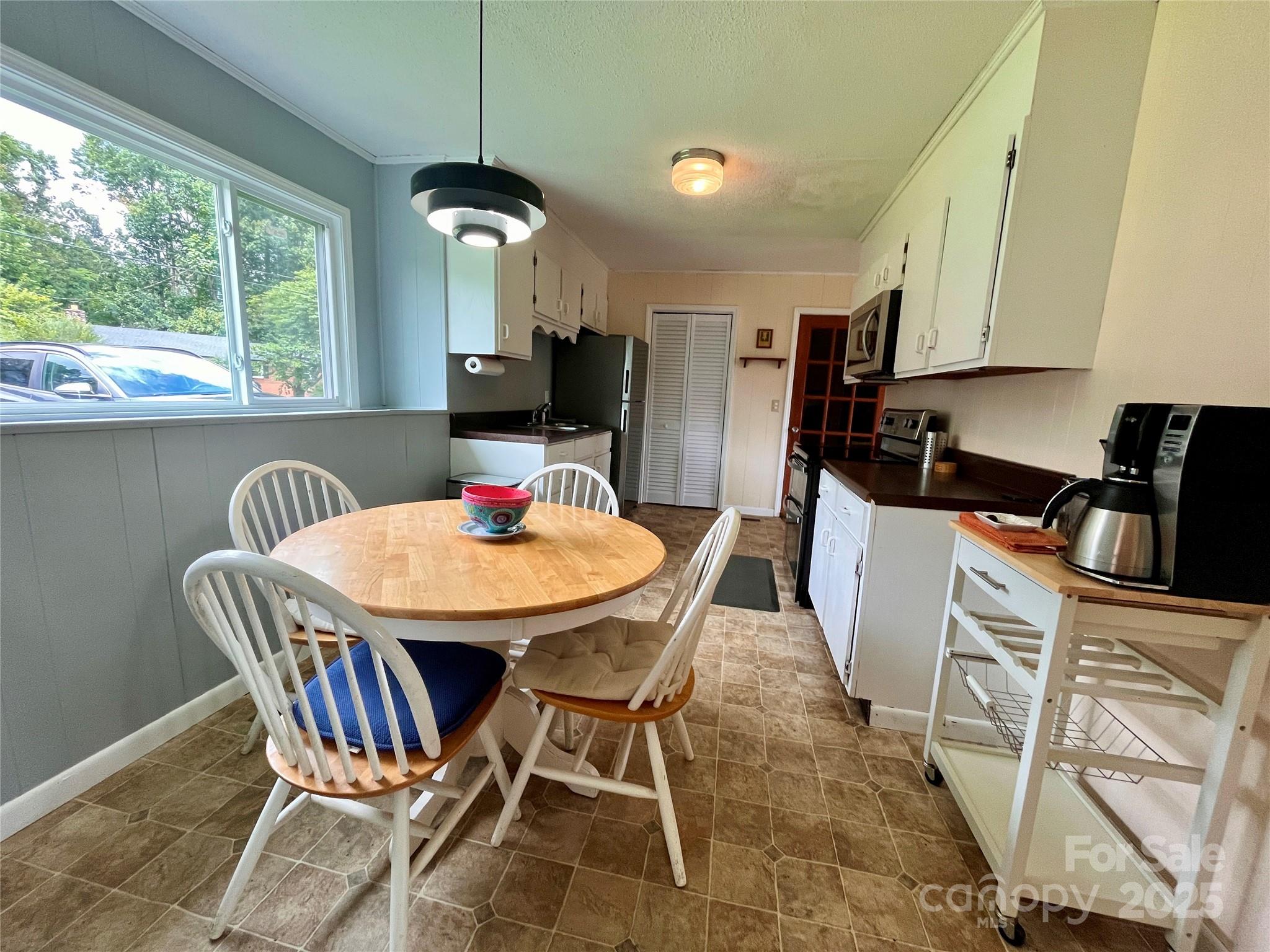 657 Arrowhead Trail Marion, NC 28752 - Photo 8 of 22 a view of a dining room with furniture window and outside view