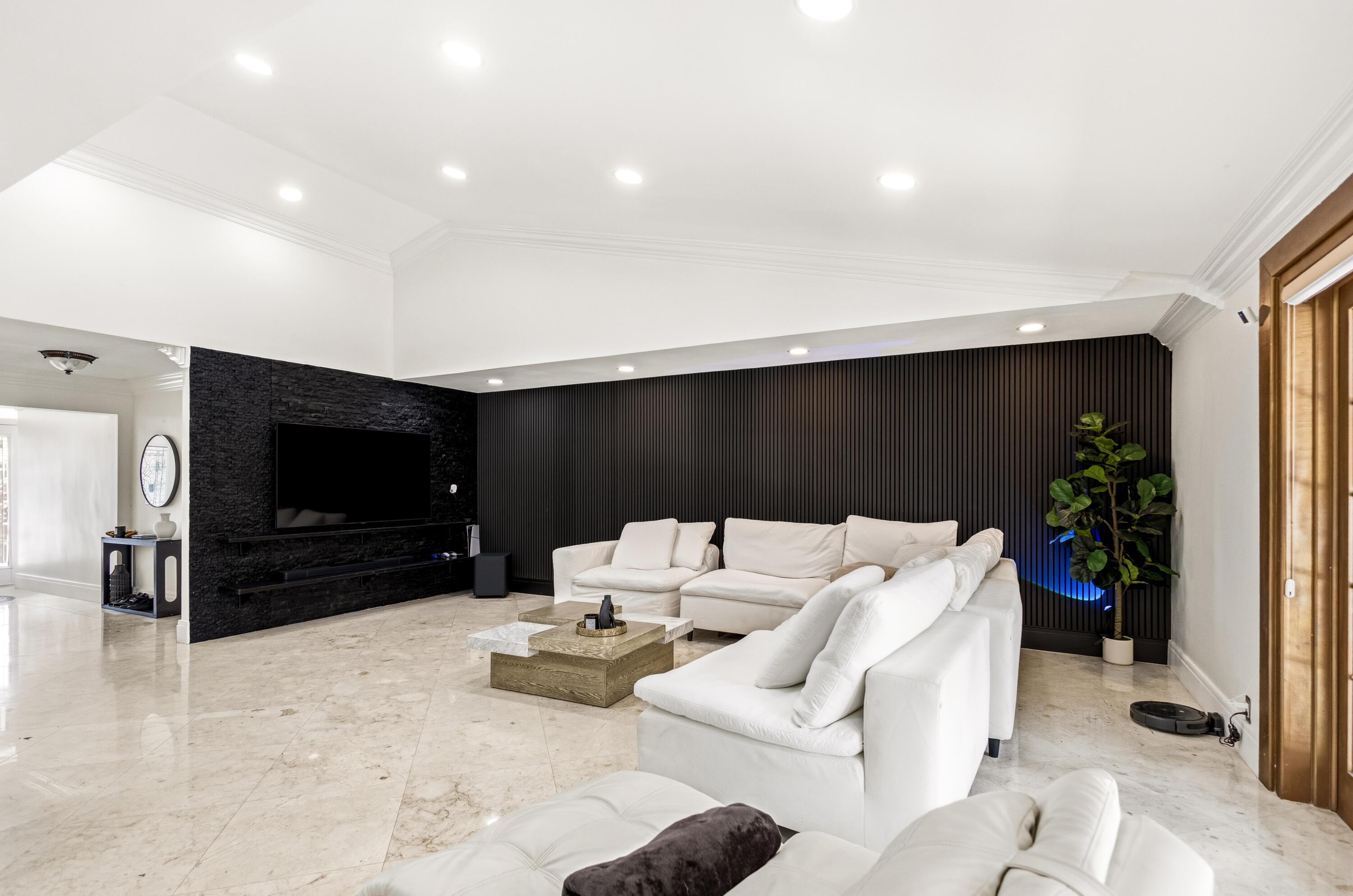 5223 Deerhurst Crescent Circle Boca Raton, FL 33486 - Photo 16 of 51 a living room with furniture and a flat screen tv