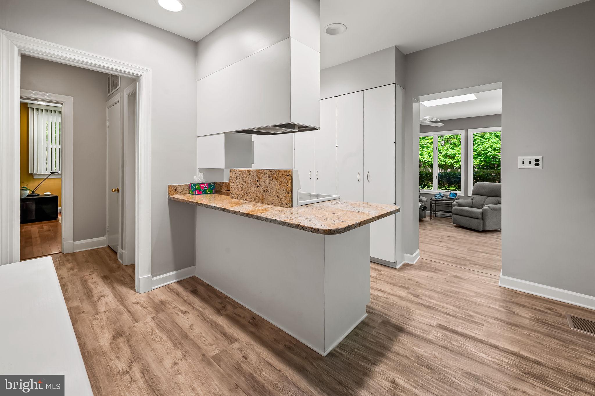 2115 Our Lane Stevenson, MD 21153 - Photo 20 of 48 a dining hall with granite countertop a stove and a sink