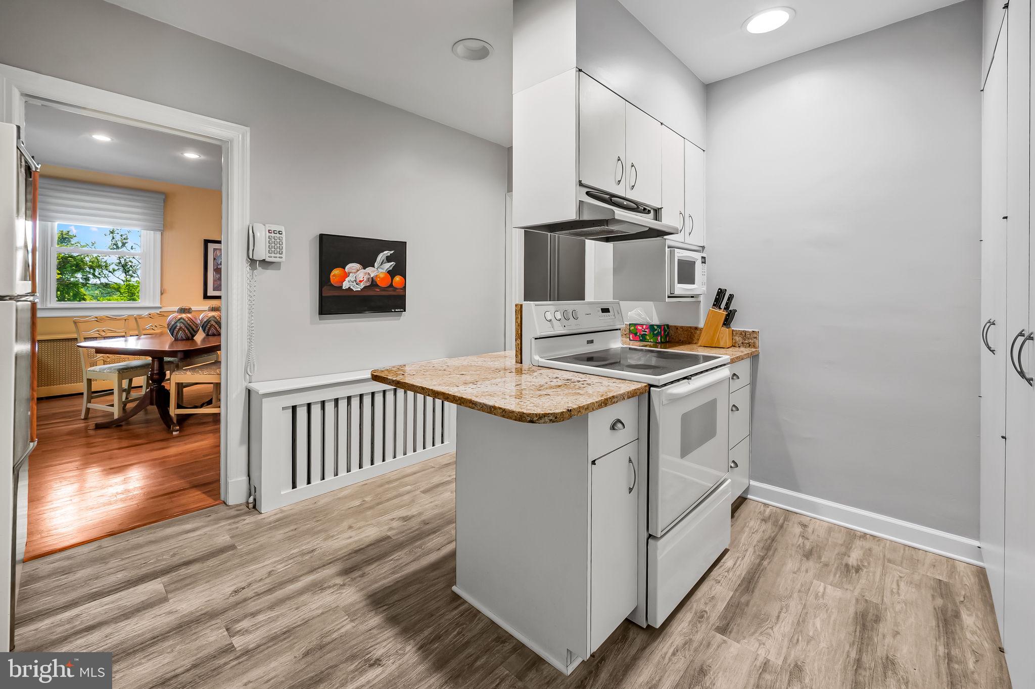 2115 Our Lane Stevenson, MD 21153 - Photo 21 of 48 a kitchen with sink cabinets and wooden floor