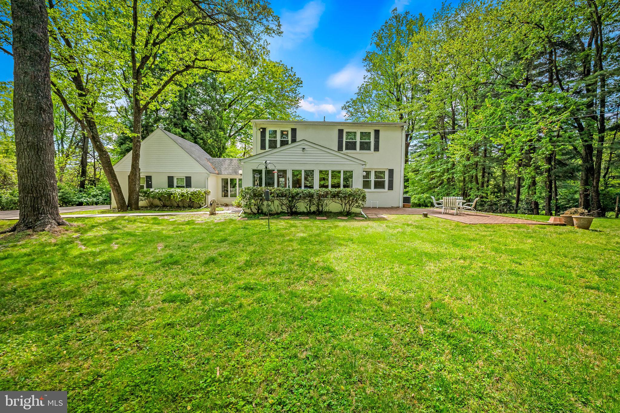 2115 Our Lane Stevenson, MD 21153 - Photo 3 of 48 a front view of a house with a yard and trees
