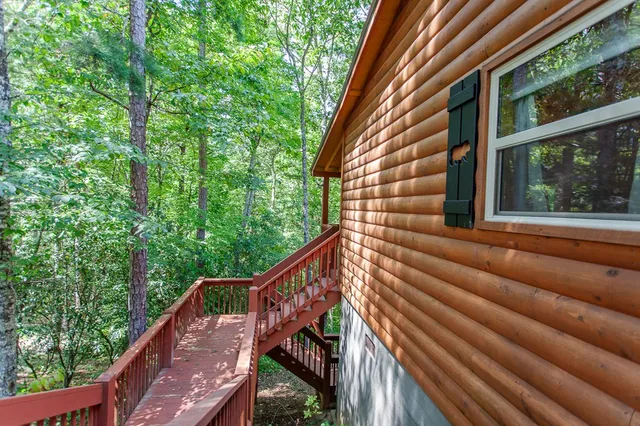 a view of outdoor space with wooden floor and windows
