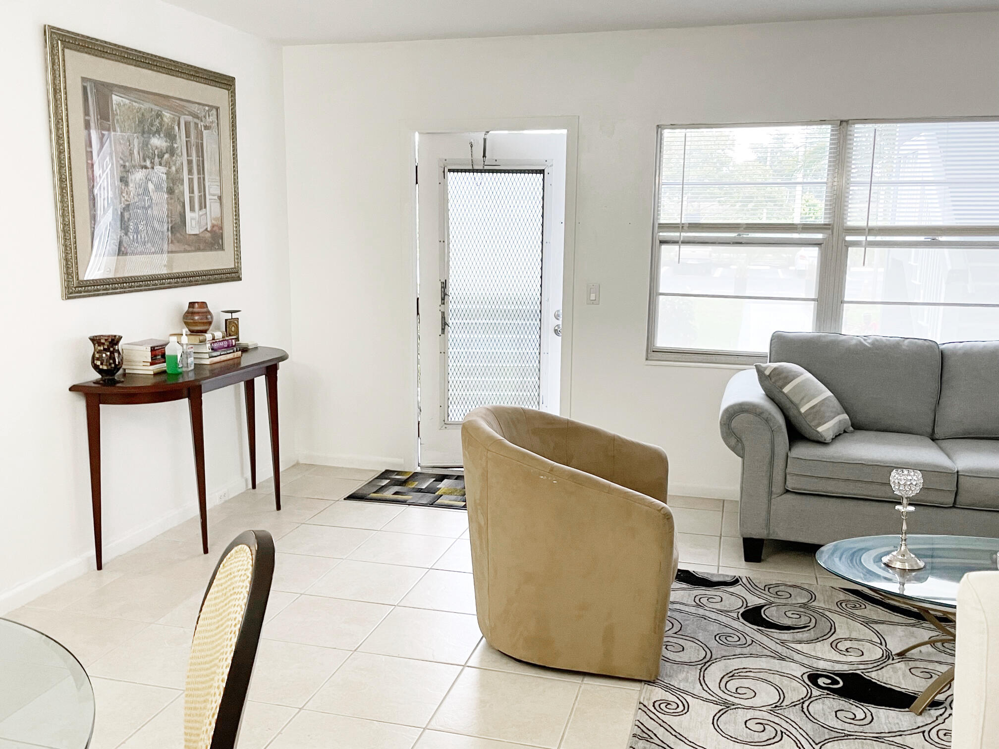 171 Suffolk F, Unit 171 Boca Raton, FL 33434 - Photo 4 of 21 a living room with furniture and a window