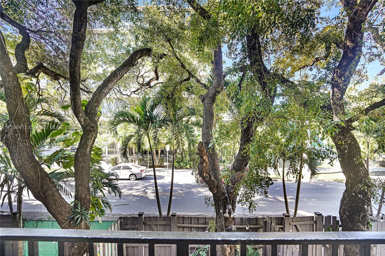 123 Southwest 17th Road, Unit 104 Miami, FL 33129 - Photo 14 of 34 a view of a yard with large trees