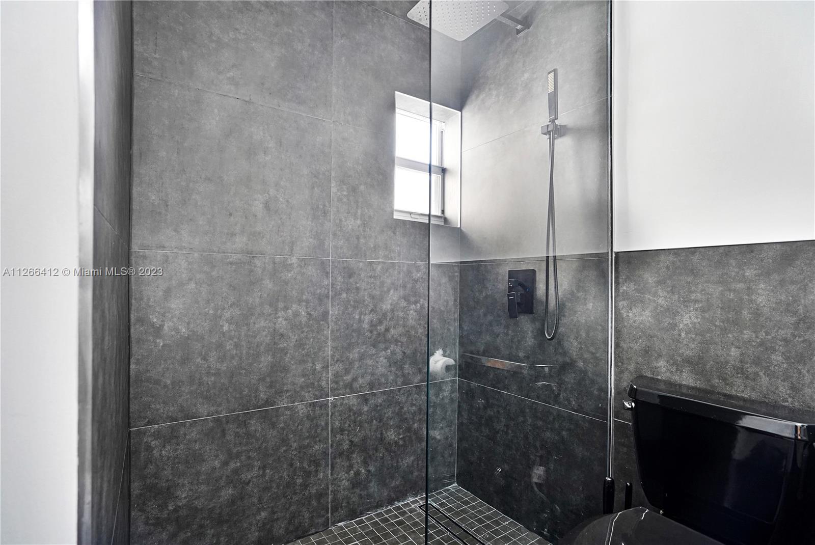 123 Southwest 17th Road, Unit 104 Miami, FL 33129 - Photo 24 of 34 a bathroom with a shower
