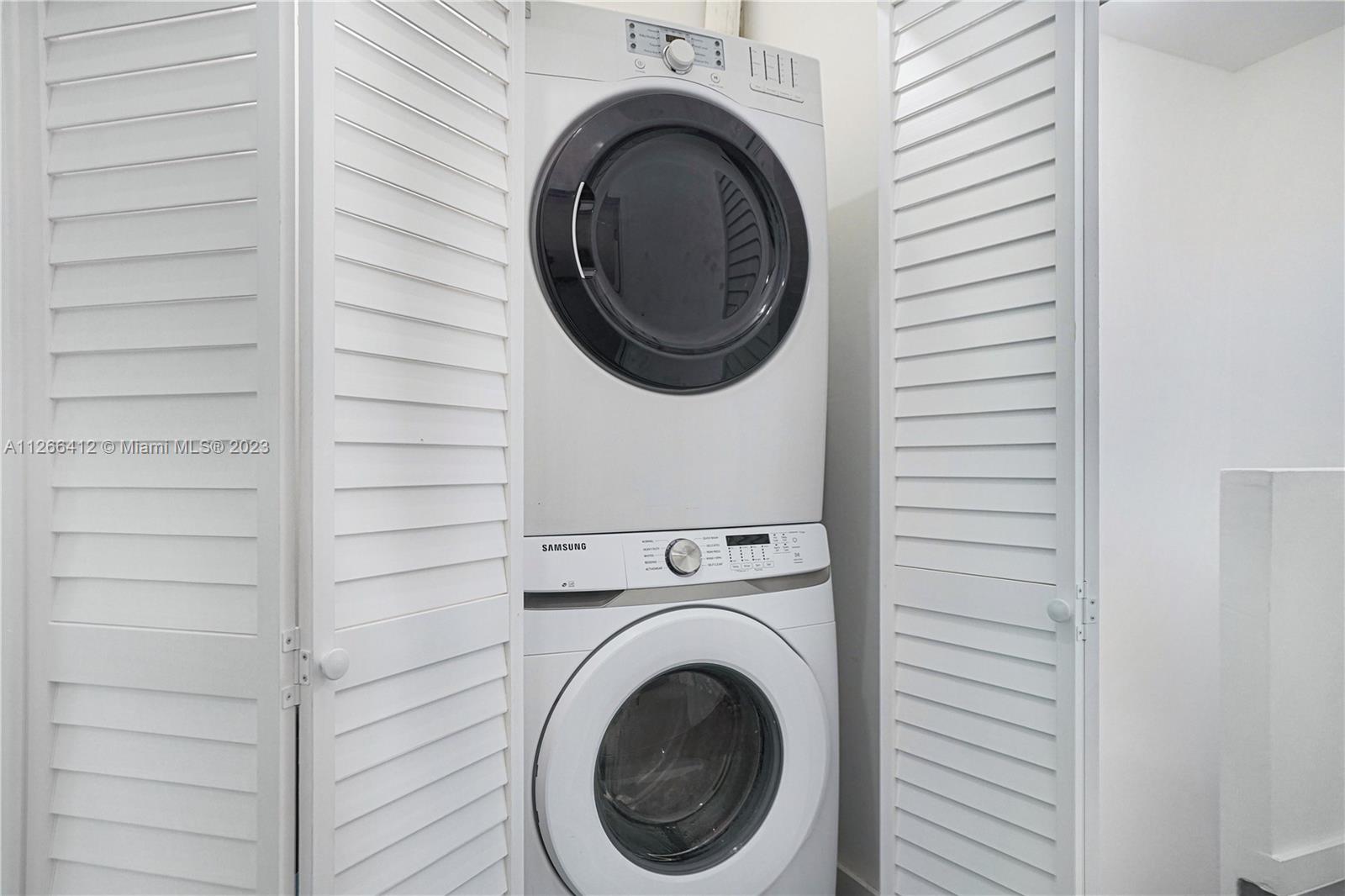 123 Southwest 17th Road, Unit 104 Miami, FL 33129 - Photo 26 of 34 a close up view of a washer and dryer in a utility room
