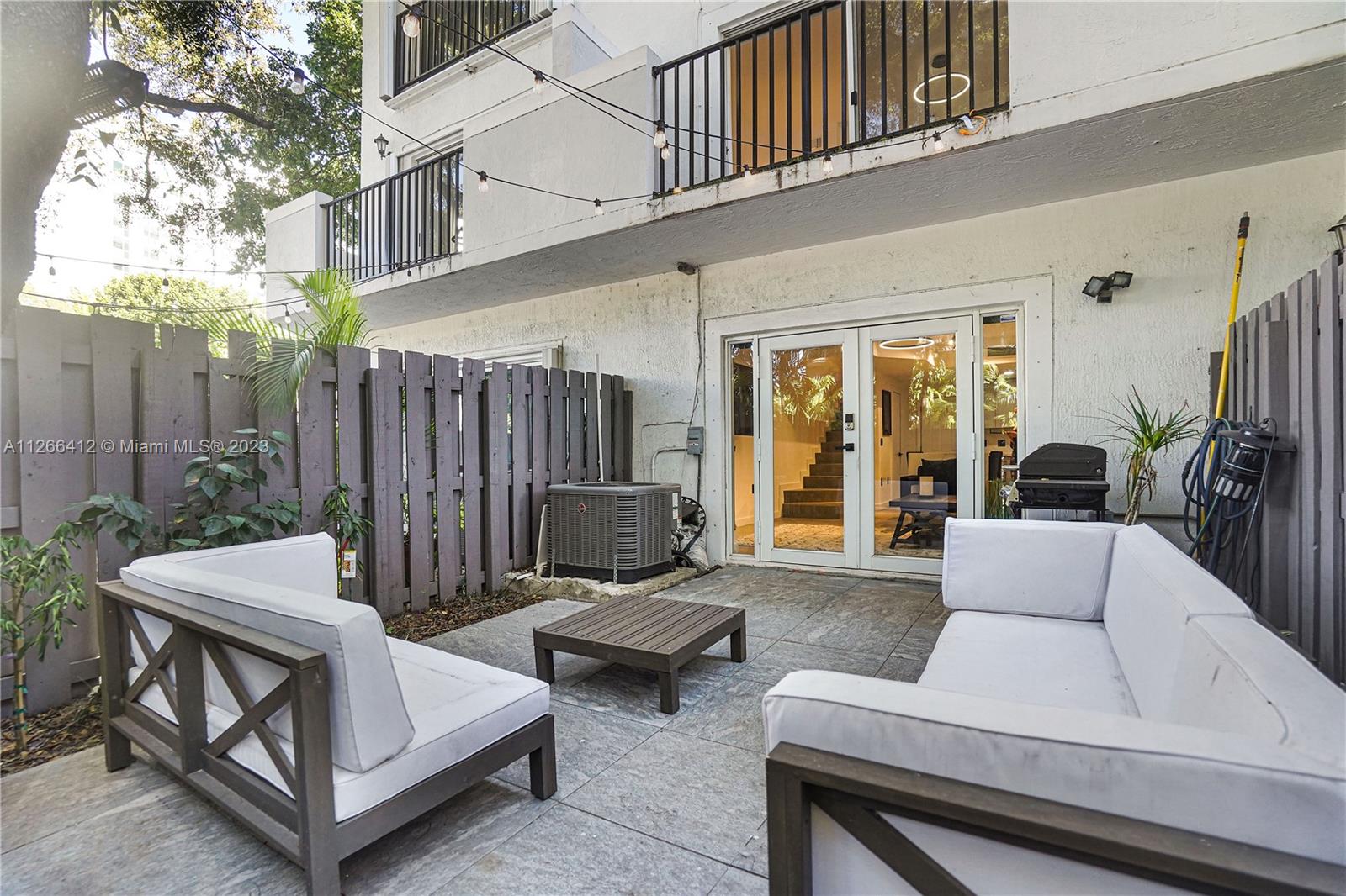 123 Southwest 17th Road, Unit 104 Miami, FL 33129 - Photo 29 of 34 a outdoor space with patio furniture