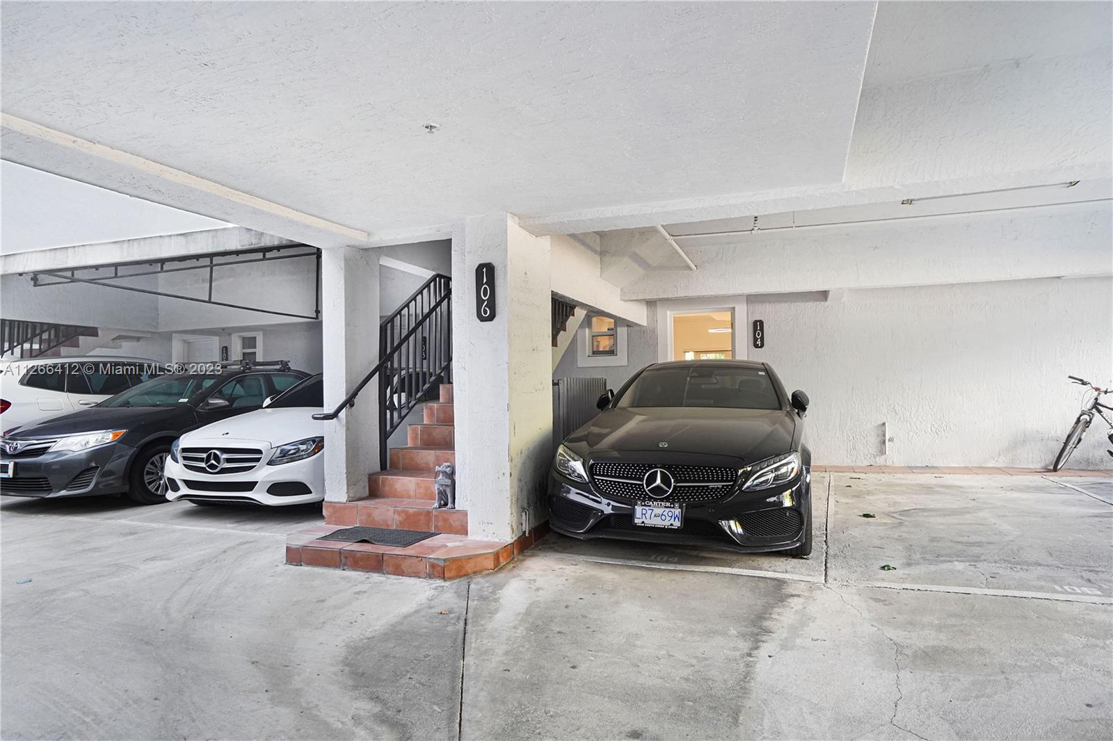 123 Southwest 17th Road, Unit 104 Miami, FL 33129 - Photo 31 of 34 a view of parking garage with cars parked