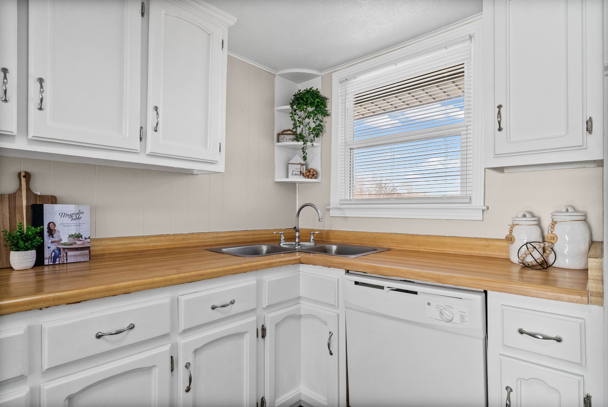 212 Jackson Road Clarksville, TN 37042 - Photo 12 of 32 a kitchen with stainless steel appliances white cabinets and a sink