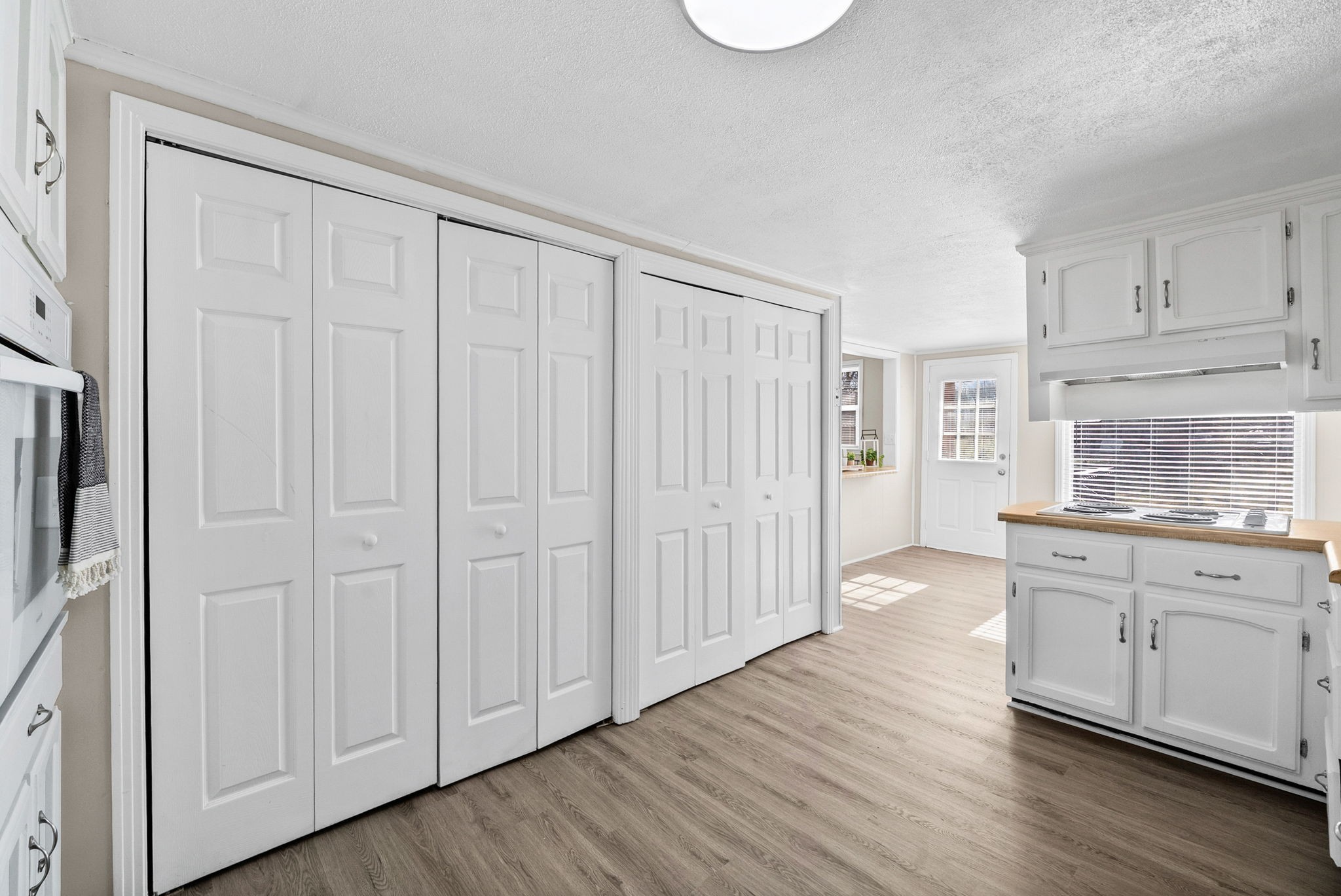 212 Jackson Road Clarksville, TN 37042 - Photo 14 of 32 a kitchen with white cabinets a sink and dishwasher