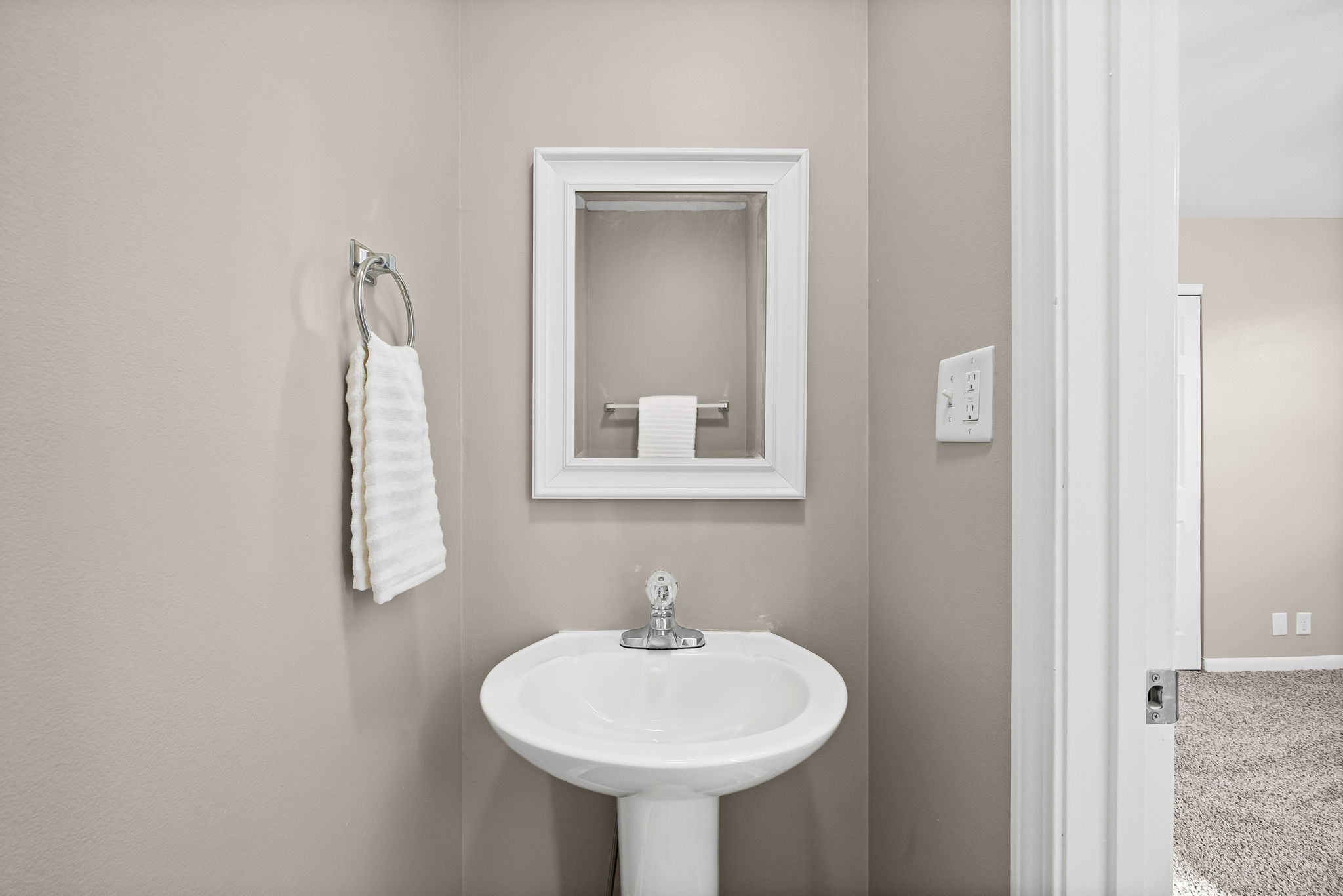 212 Jackson Road Clarksville, TN 37042 - Photo 17 of 32 a bathroom with a sink a mirror and a lamp