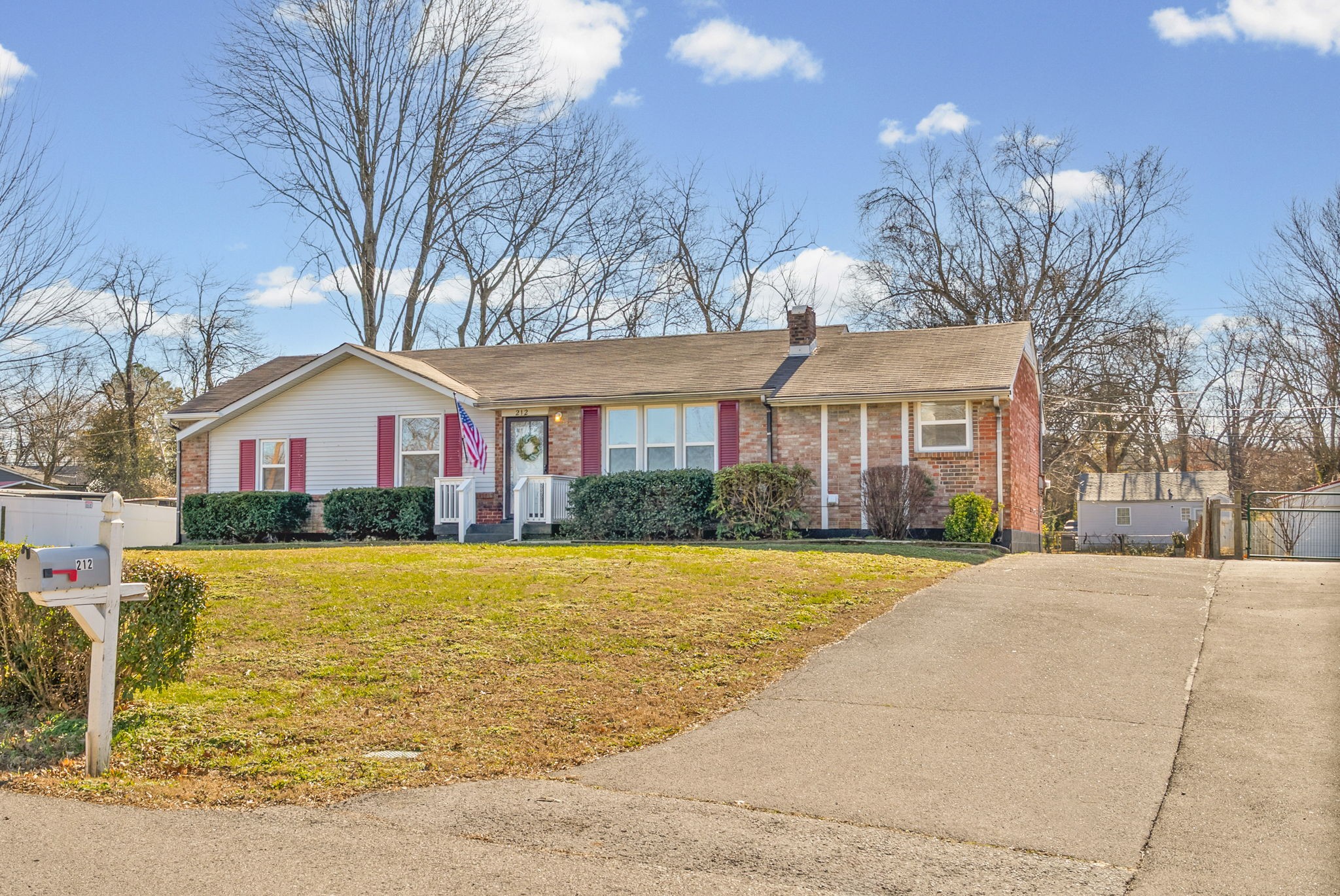 212 Jackson Road Clarksville, TN 37042 - Photo 23 of 32 a front view of house with yard and trees around
