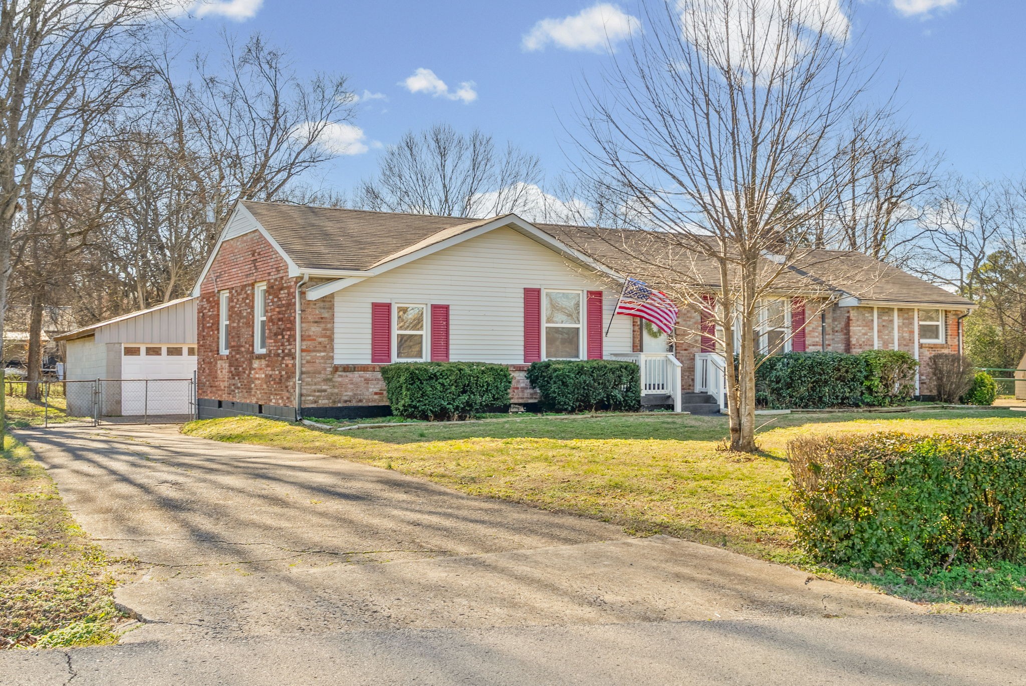 212 Jackson Road Clarksville, TN 37042 - Photo 28 of 32 a front view of a house with a yard and garage