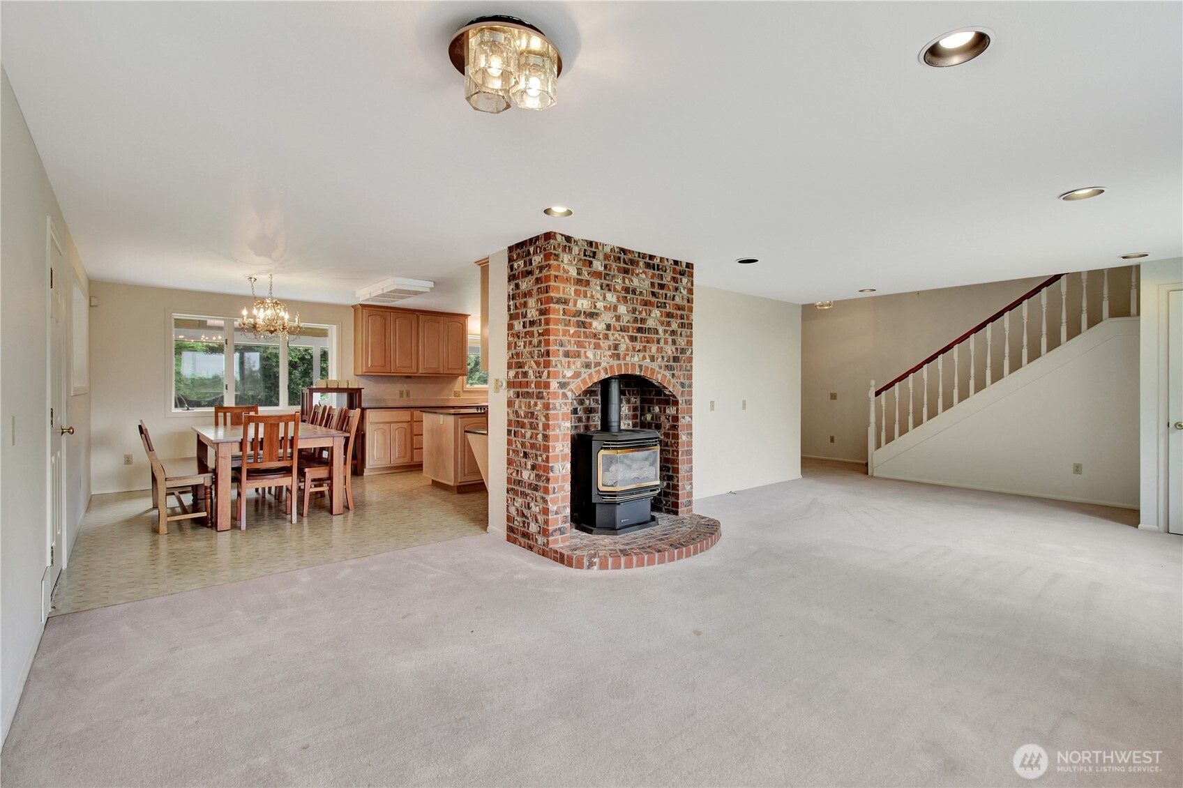 963 Utsalady Road Camano Island, WA 98282 - Photo 15 of 40 a view of a livingroom with furniture and a fireplace