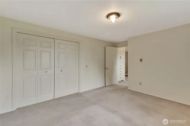 a view of a hallway with closet area