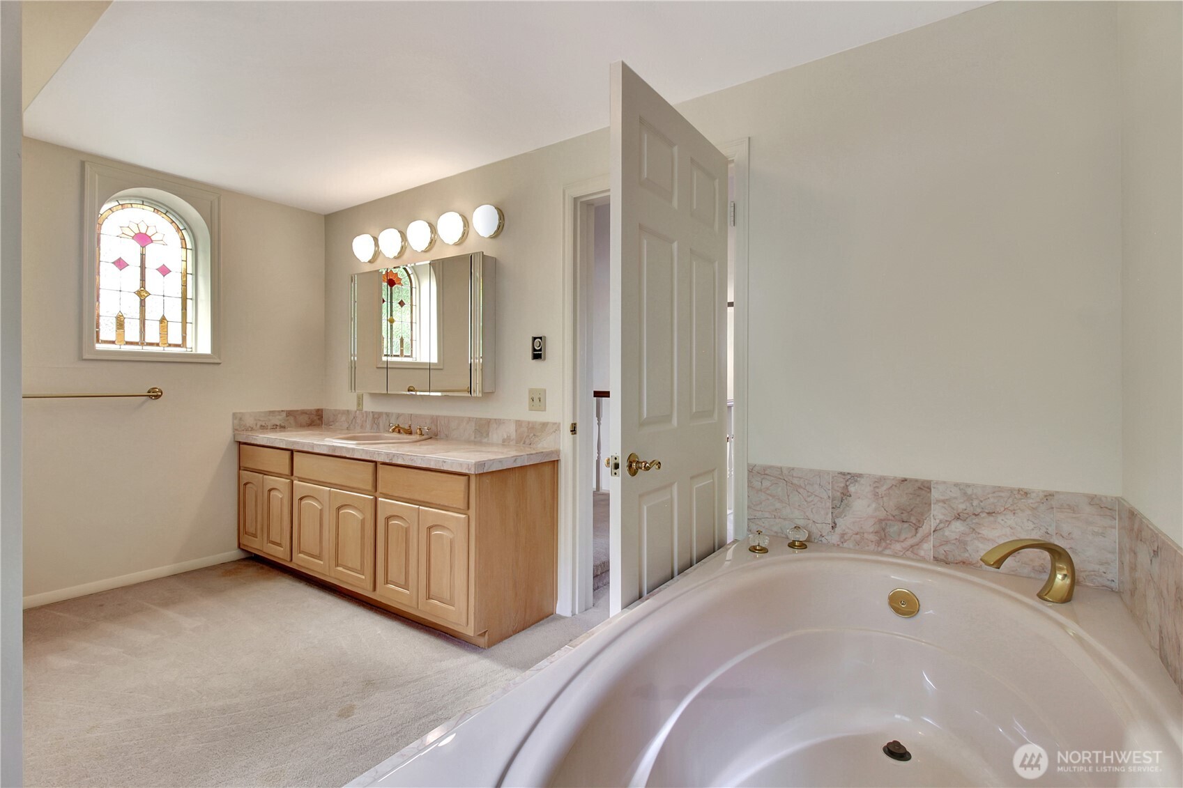 963 Utsalady Road Camano Island, WA 98282 - Photo 24 of 40 a bathroom with a tub sink and mirror
