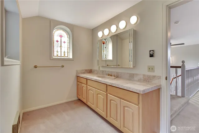 a white bath tub sitting next to a toilet