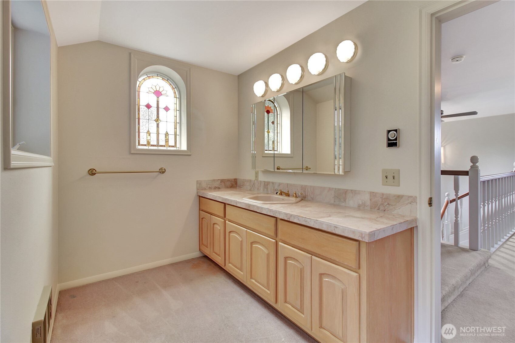 963 Utsalady Road Camano Island, WA 98282 - Photo 25 of 40 a bathroom with a sink a vanity and a mirror