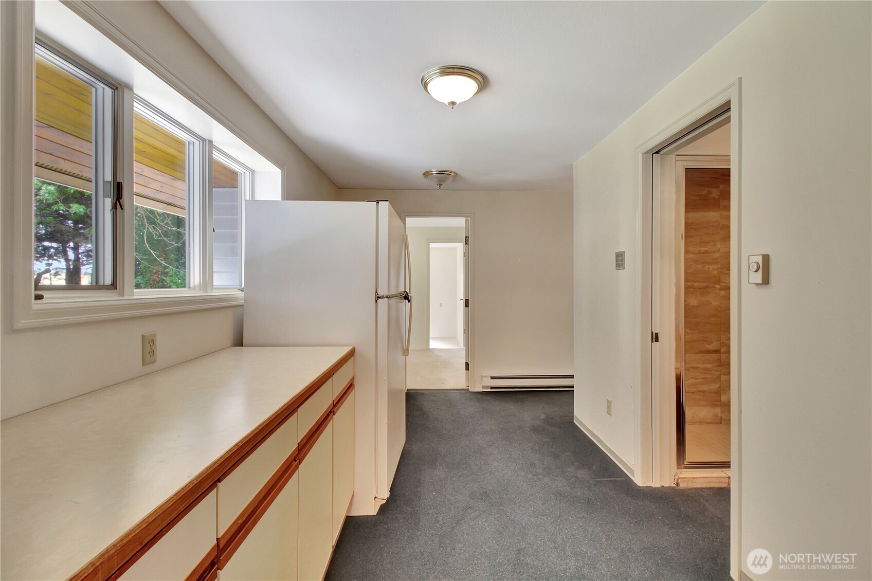 963 Utsalady Road Camano Island, WA 98282 - Photo 27 of 40 a room with a bed and a window