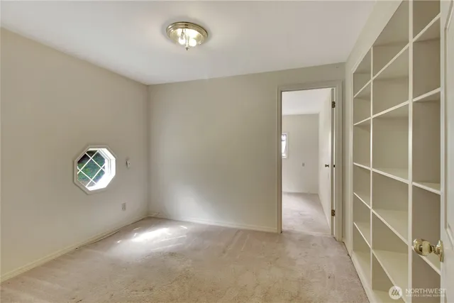 a view of a bedroom and utility room