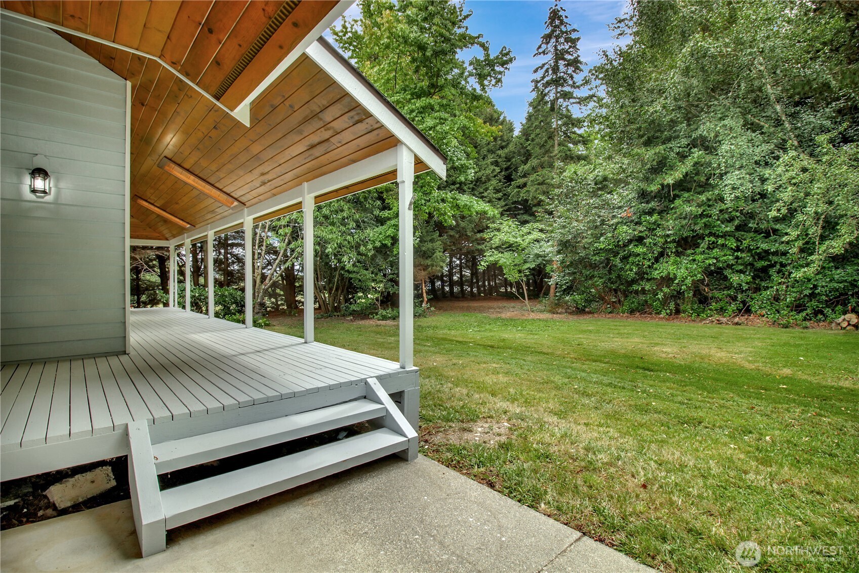 963 Utsalady Road Camano Island, WA 98282 - Photo 35 of 40 a bed sitting in a yard with large trees