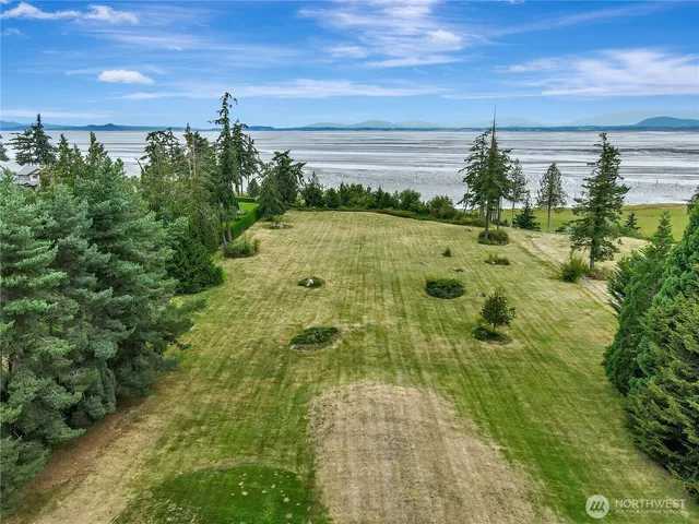 a view of a hallway with entryway and stairs