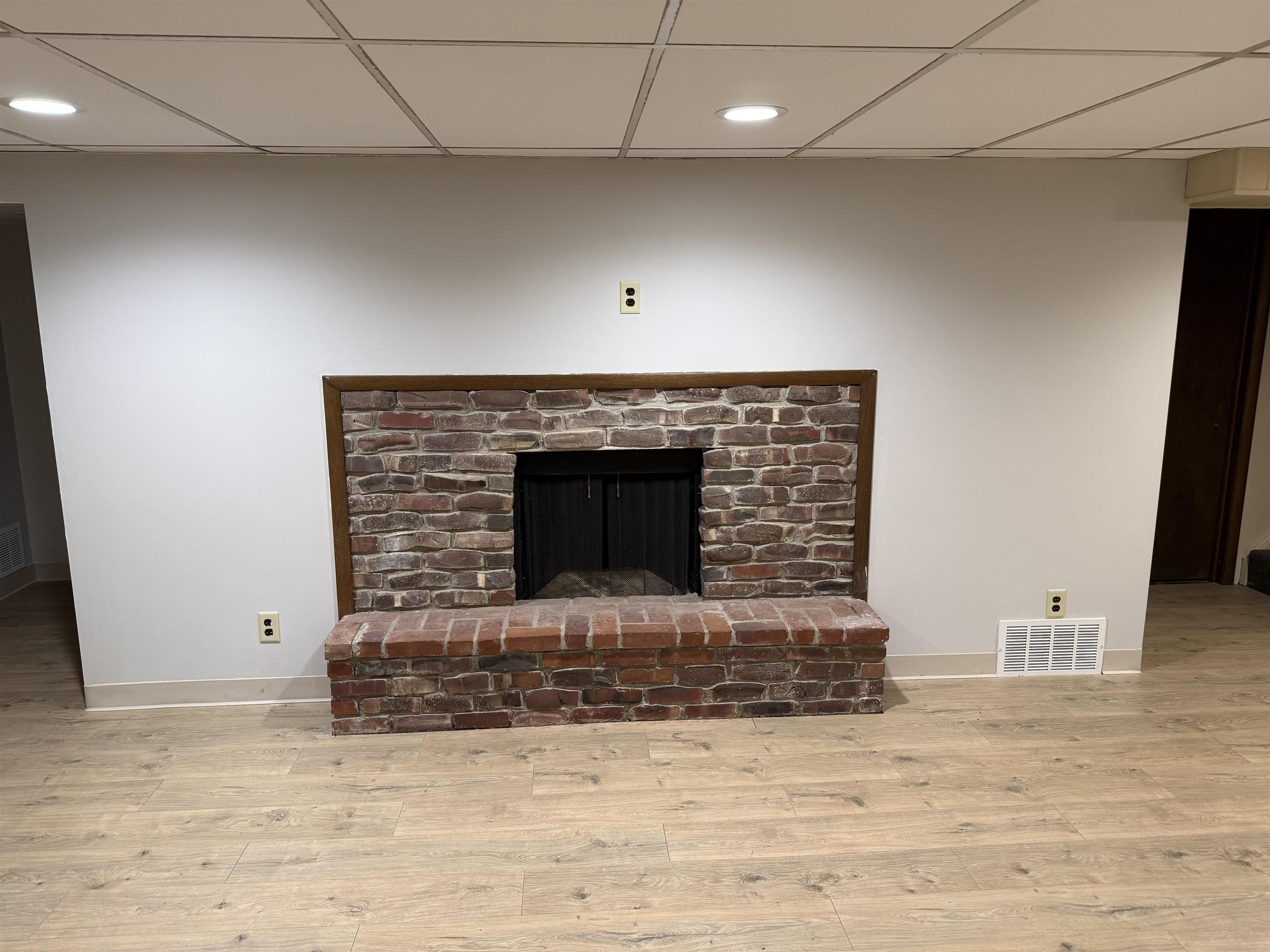 4524 Newcastle Road Rockford, IL 61108 - Photo 16 of 24 a view of fireplace and wooden floor
