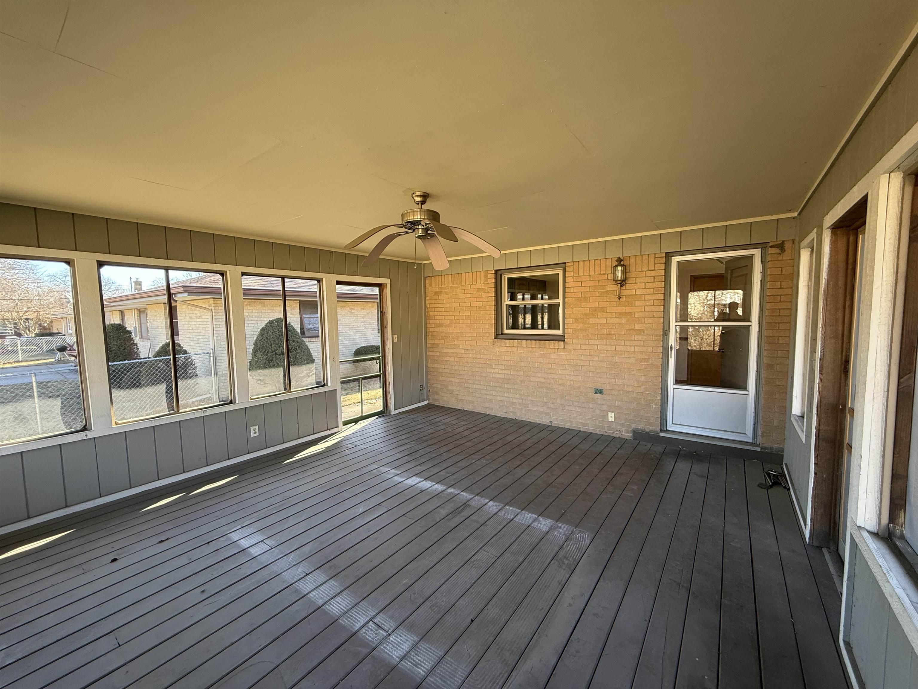 4524 Newcastle Road Rockford, IL 61108 - Photo 21 of 24 wooden floor in an empty room with a window