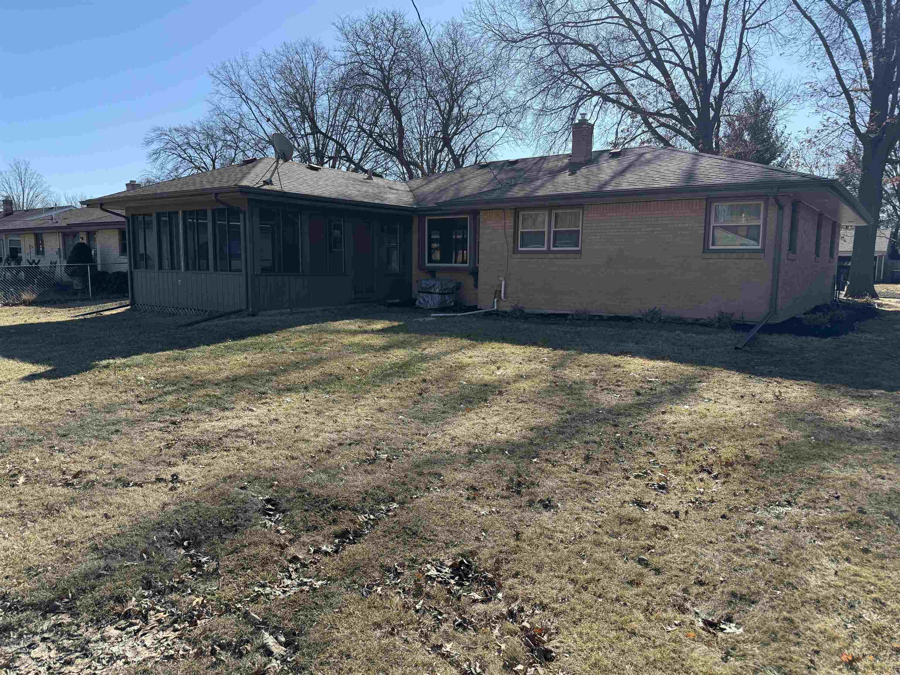 4524 Newcastle Road Rockford, IL 61108 - Photo 22 of 24 a view of a house with a yard