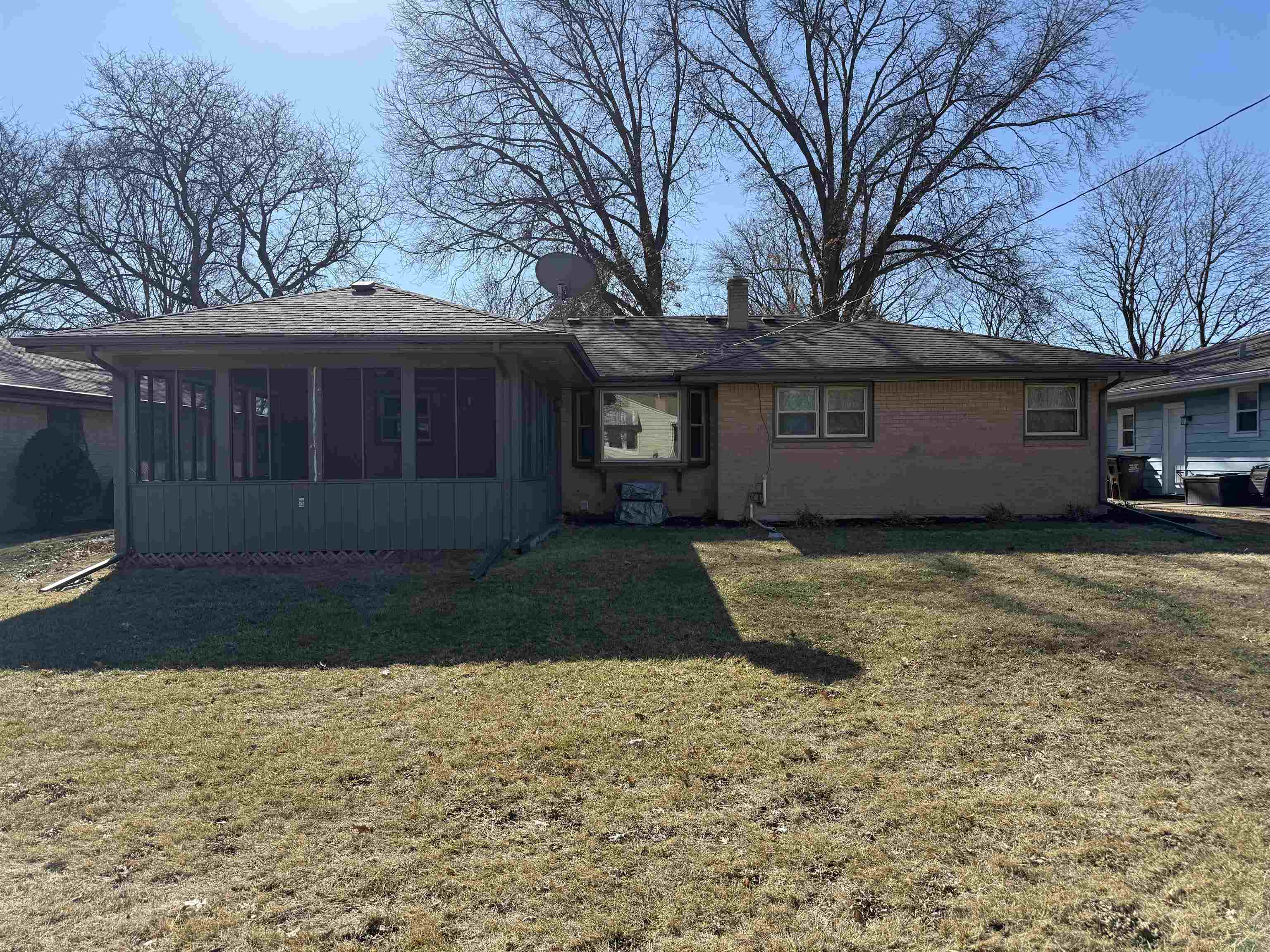 4524 Newcastle Road Rockford, IL 61108 - Photo 23 of 24 a front view of a house with a yard and garage