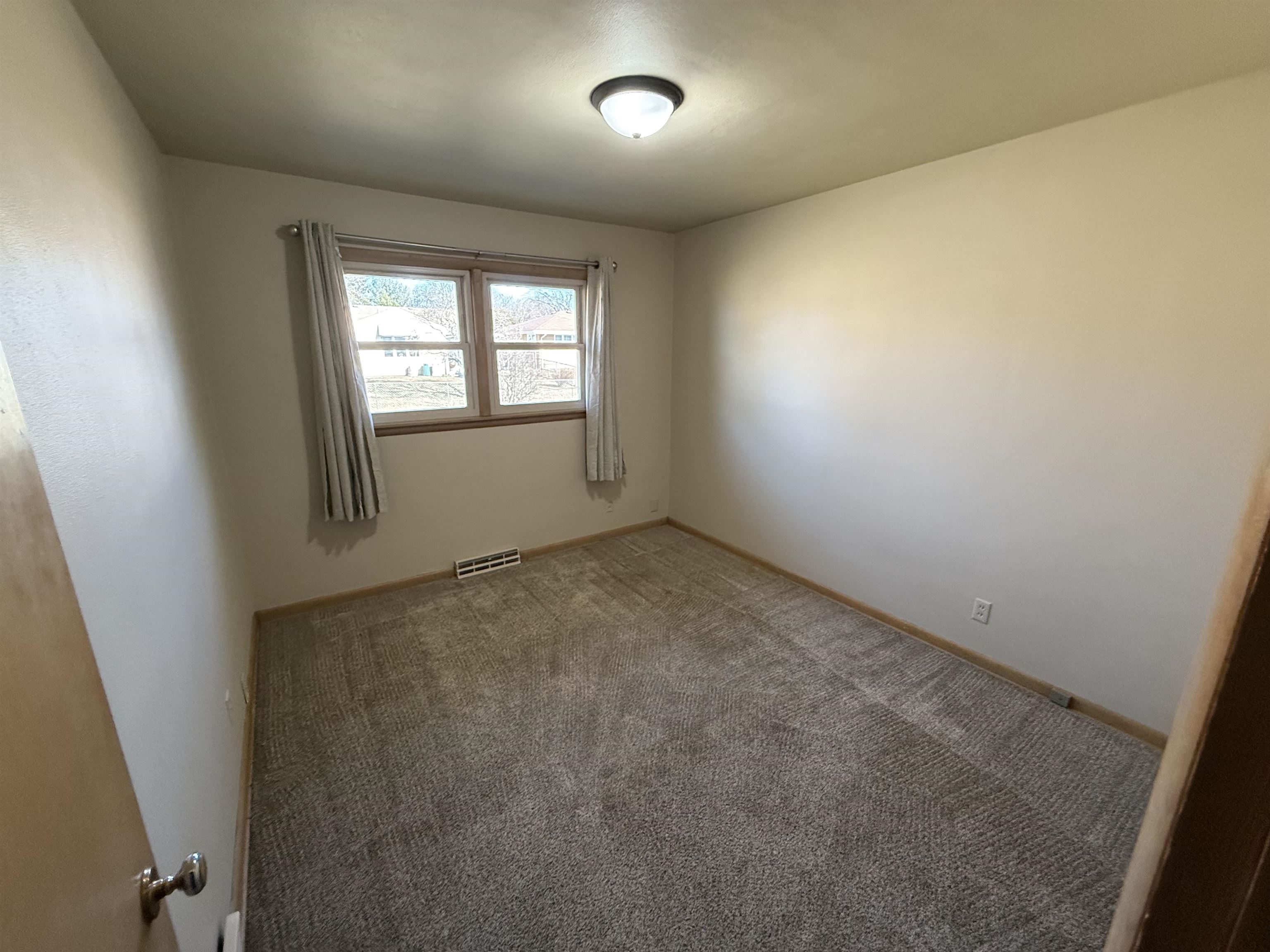 4524 Newcastle Road Rockford, IL 61108 - Photo 9 of 24 an empty room with a window