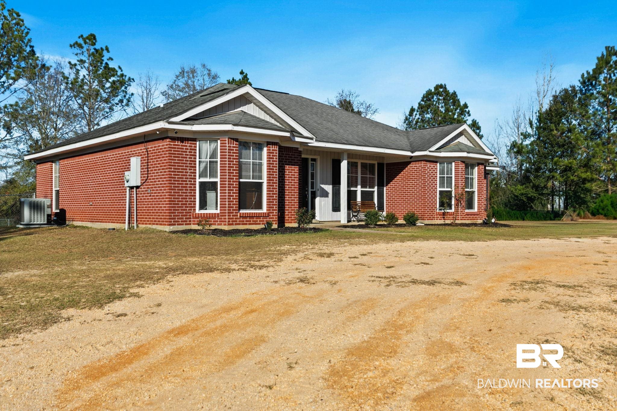 55750 Lottie Road Perdido, AL 36562 - Photo 78 of 84 Single story home with brick siding, a front lawn, and a shingled roof