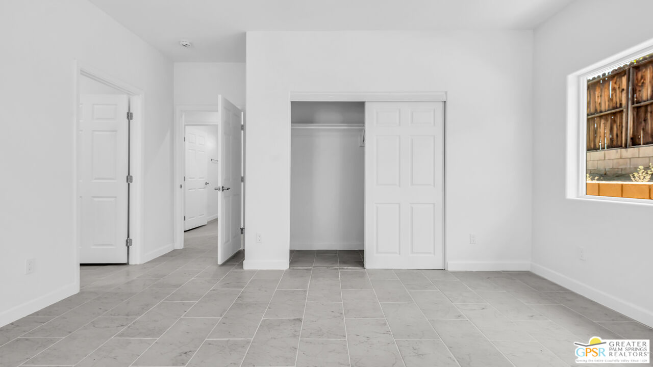 7160 Olympic Road Joshua Tree, CA 92252 - Photo 35 of 58 an empty room with windows and closet