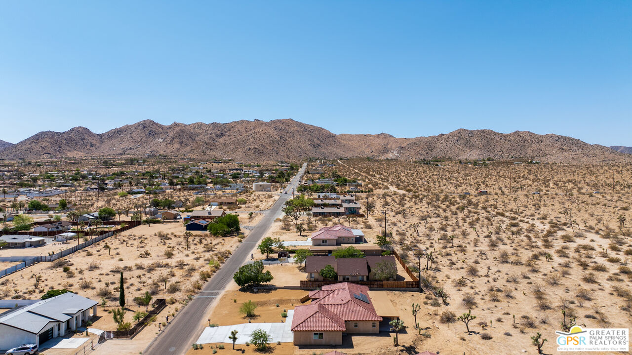 7160 Olympic Road Joshua Tree, CA 92252 - Photo 53 of 58 an aerial view of residential house and sandy dunes