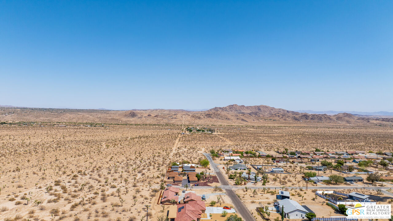 7160 Olympic Road Joshua Tree, CA 92252 - Photo 55 of 58 an aerial view of residential houses with outdoor space