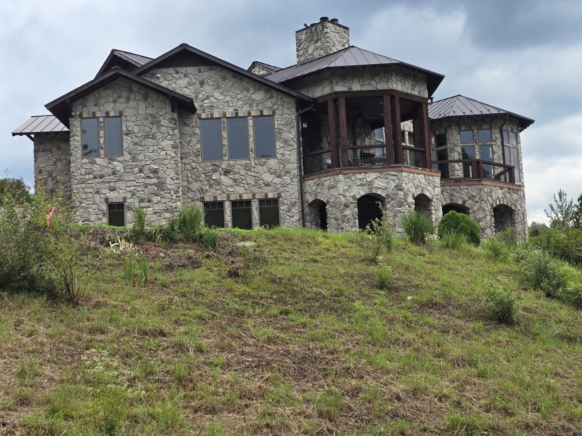 144 Seven Ridges Road Hot Springs, VA 24445 - Photo 2 of 89 a front view of a house with a yard