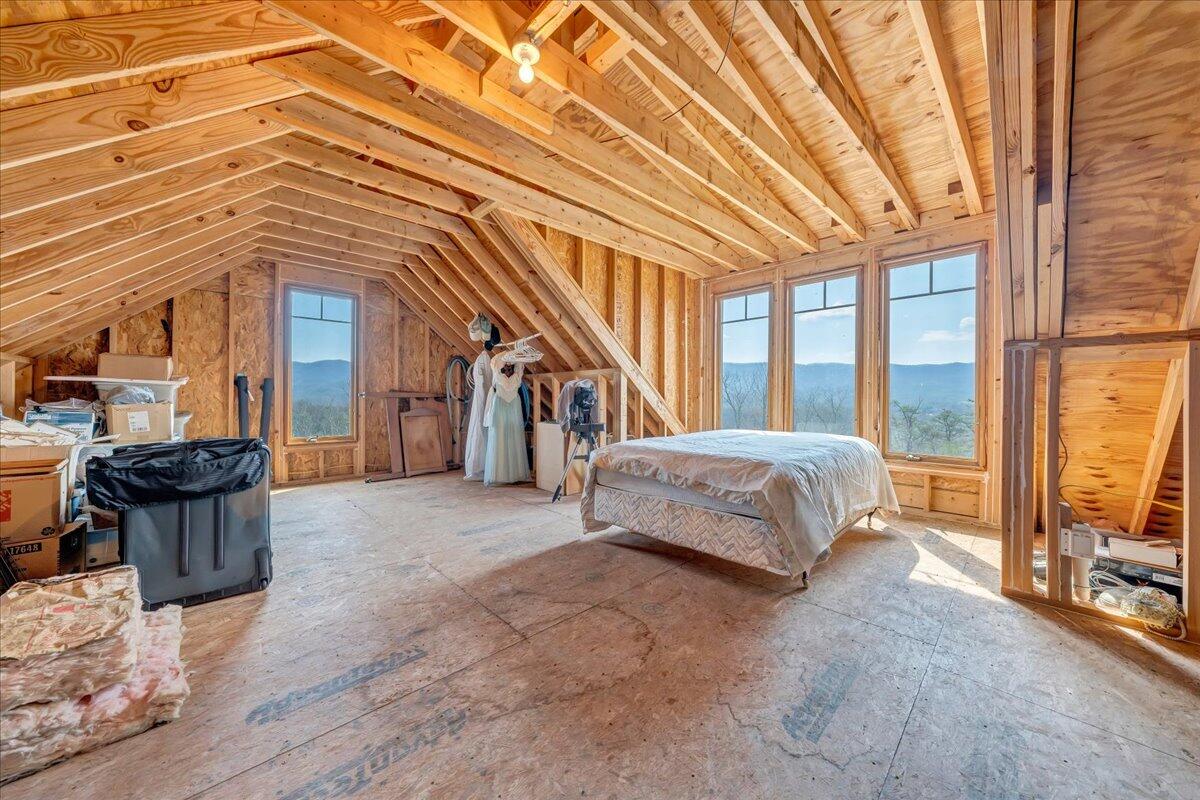 144 Seven Ridges Road Hot Springs, VA 24445 - Photo 93 of 99 a spacious bedroom with a bed and large windows