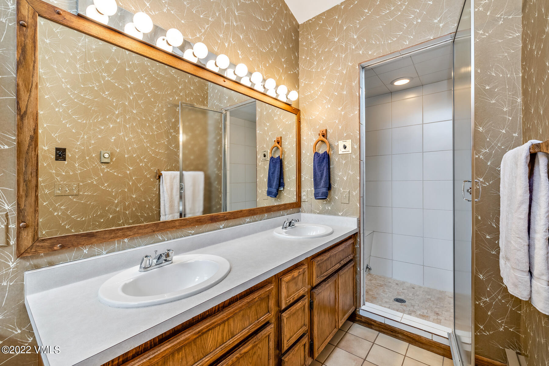 1750 South Frontage Road West, Unit E3 Vail, CO 81657 - Photo 20 of 39 a bathroom with a sink double vanity and a mirror