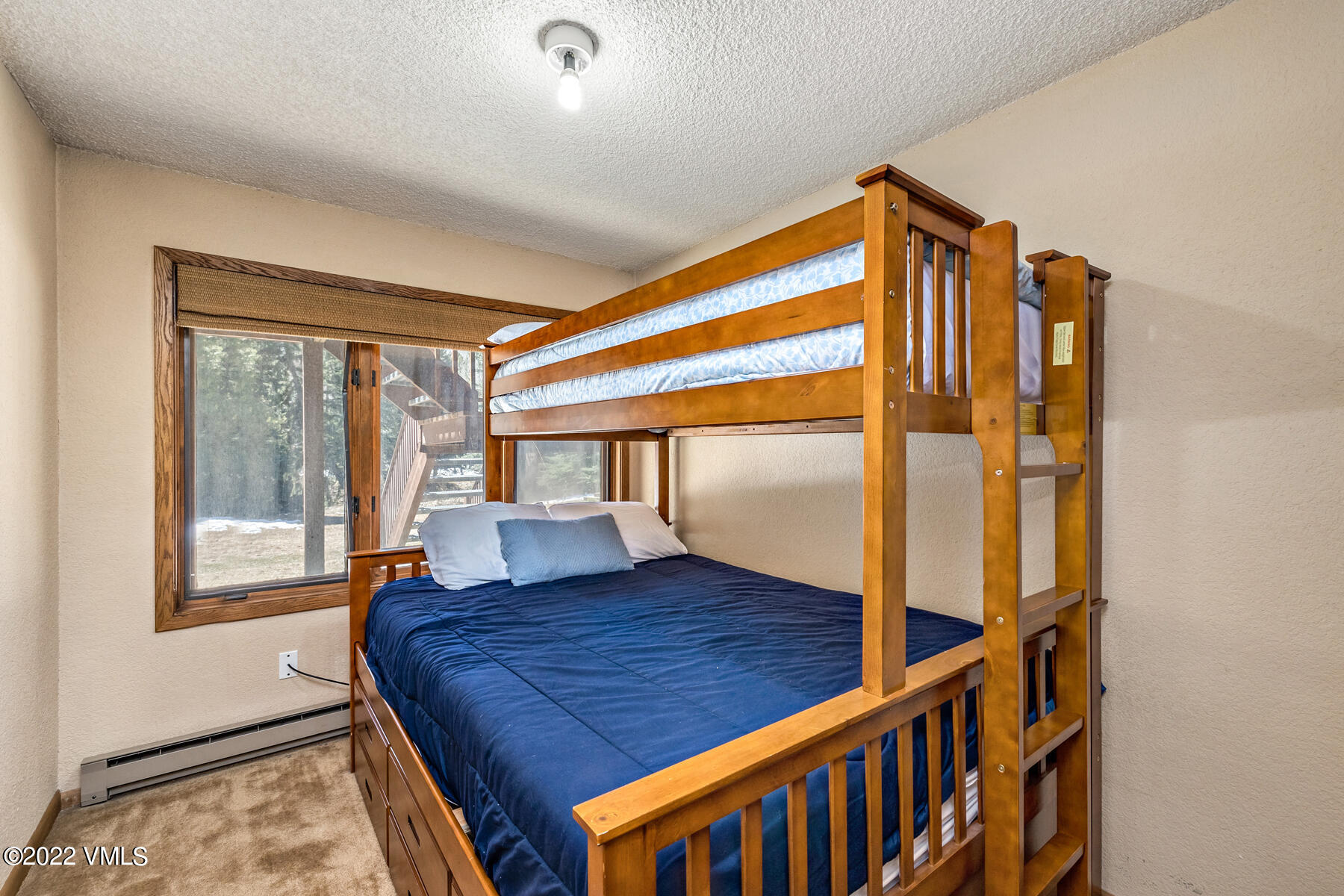 1750 South Frontage Road West, Unit E3 Vail, CO 81657 - Photo 22 of 39 a view of front door with furniture and wooden floor