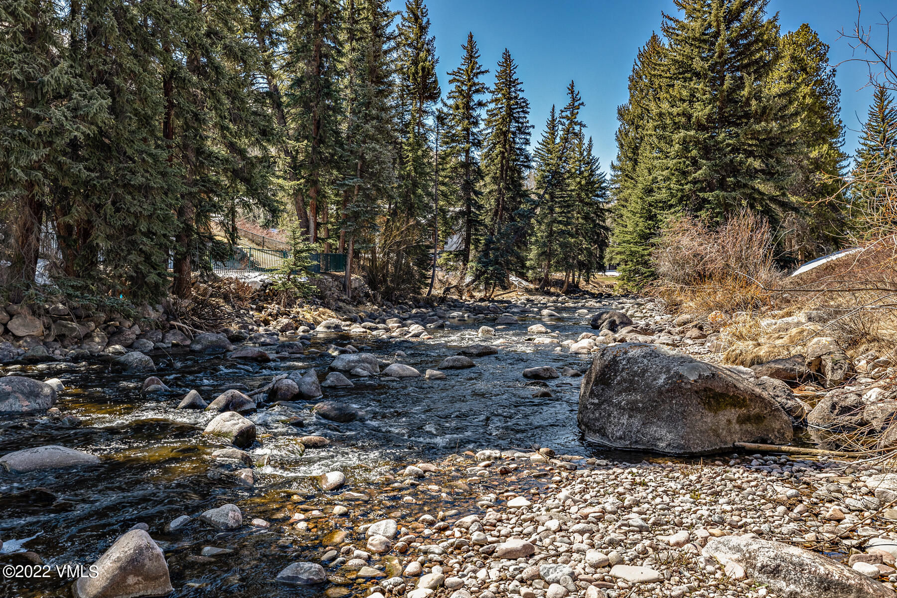 1750 South Frontage Road West, Unit E3 Vail, CO 81657 - Photo 26 of 39 a view of a dry yard with trees and covered with fog