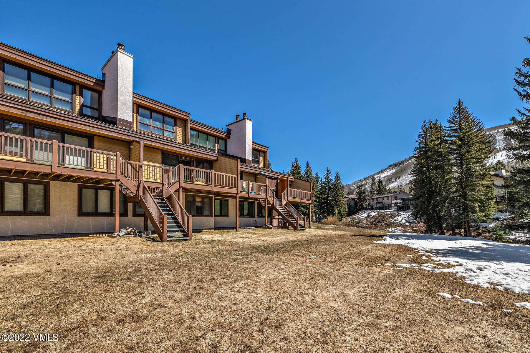 1750 South Frontage Road West, Unit E3 Vail, CO 81657 - Photo 29 of 39 a front view of a house with a yard