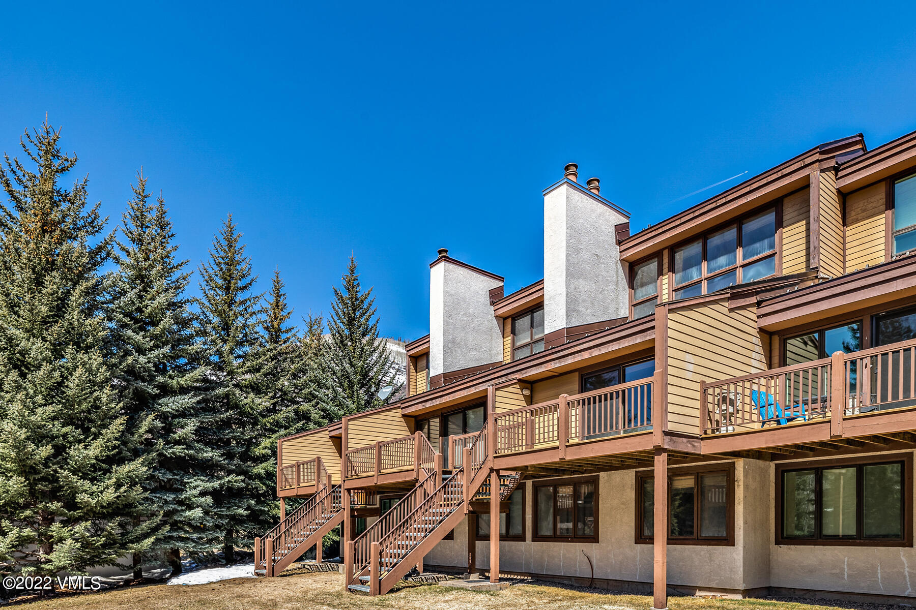 1750 South Frontage Road West, Unit E3 Vail, CO 81657 - Photo 30 of 39 a front view of a building with a tree