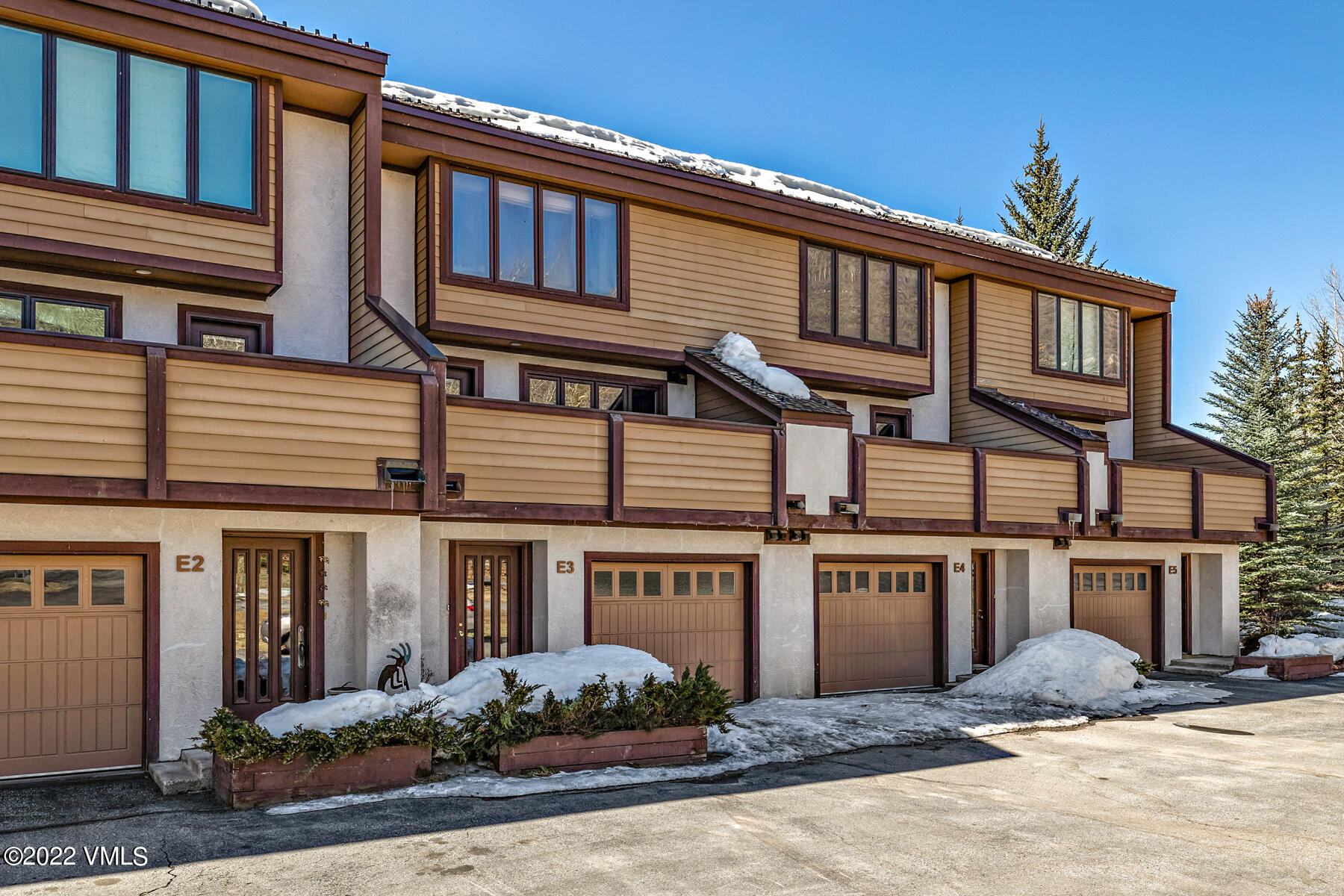 1750 South Frontage Road West, Unit E3 Vail, CO 81657 - Photo 35 of 39 front view of a house with a yard